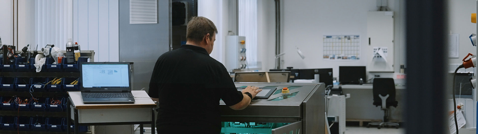 Man working on controls