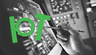 A person using a touch screen with the phrase IOT superimposed on it